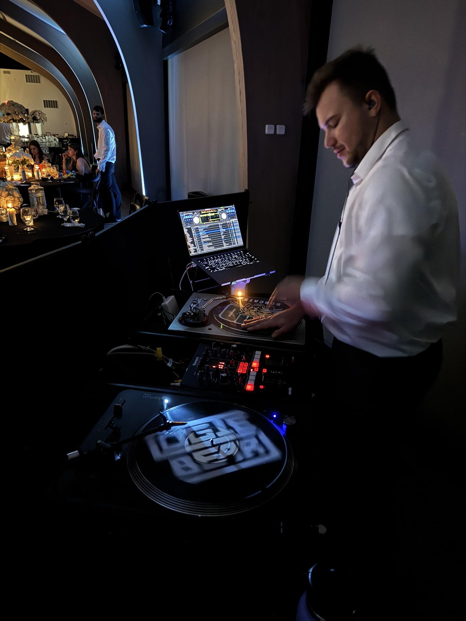 LogieBear at the DJ controllers during a formal evening corporate event in Columbus